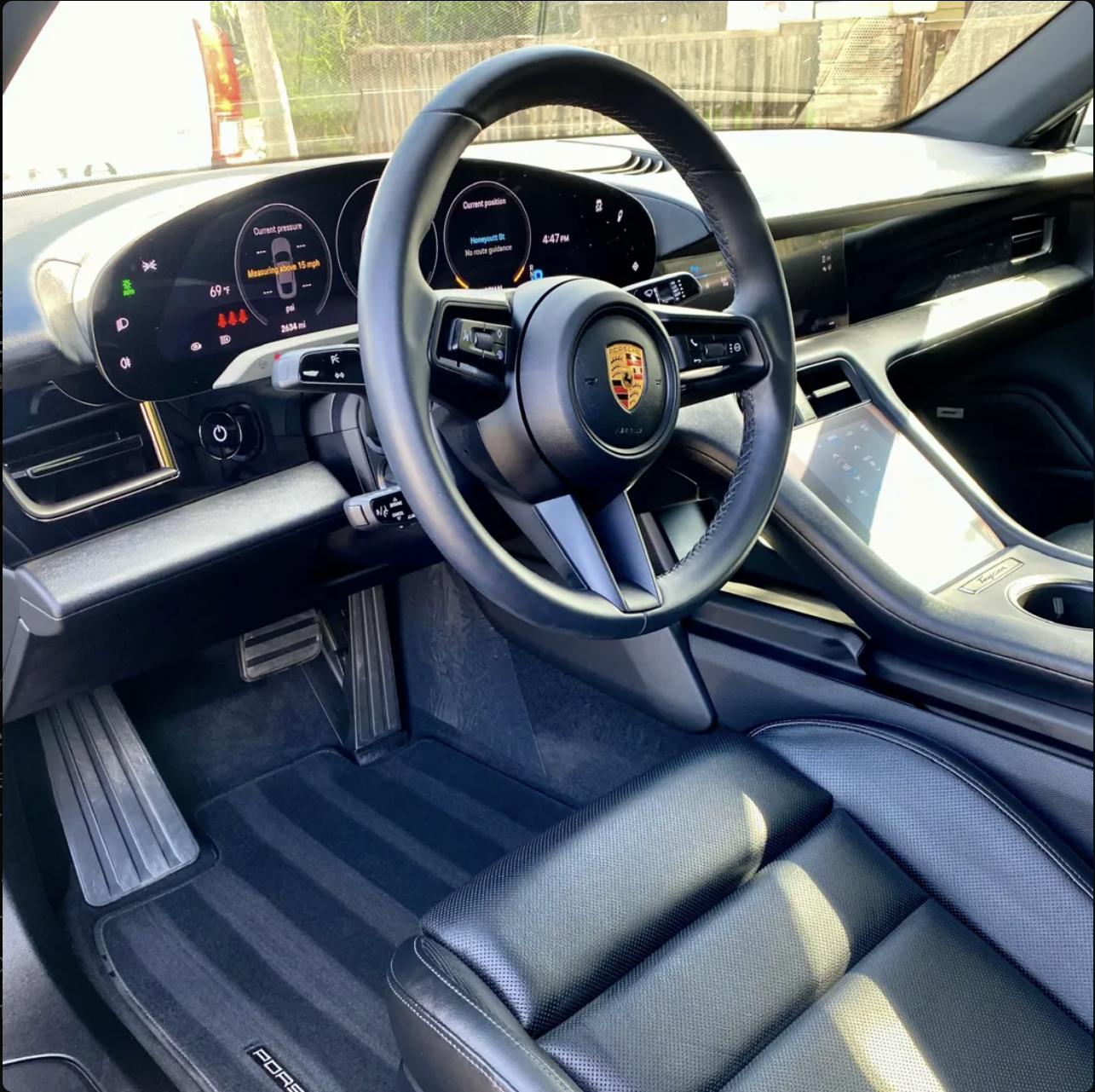 Spotless Porsche interior with detailed floor mats